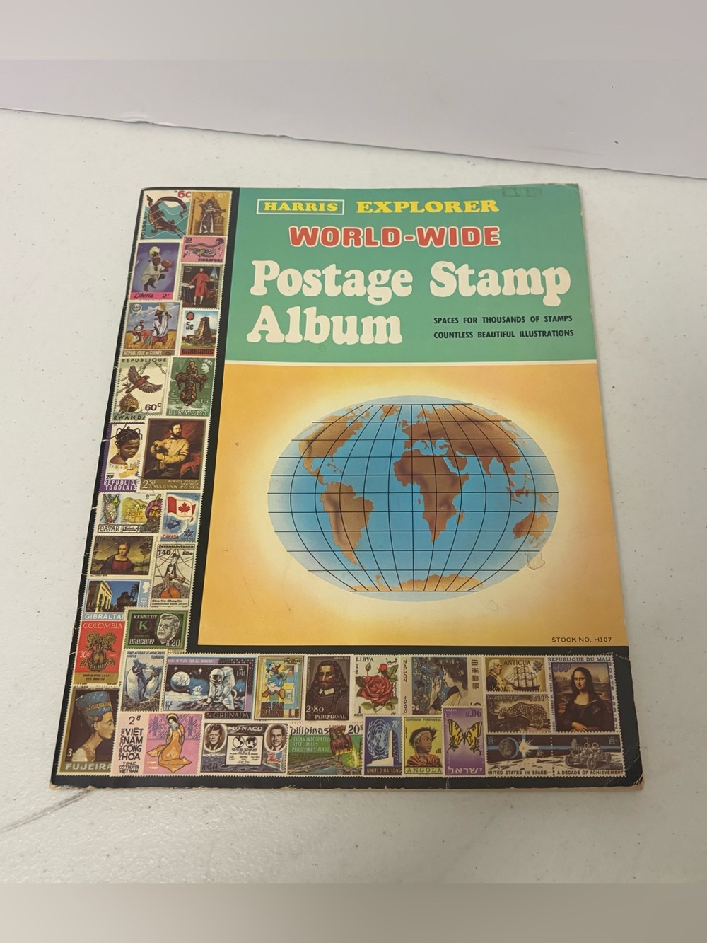 Vintage 1977 Harris Explorer World-Wide Postage Stamp Album includes Stamps